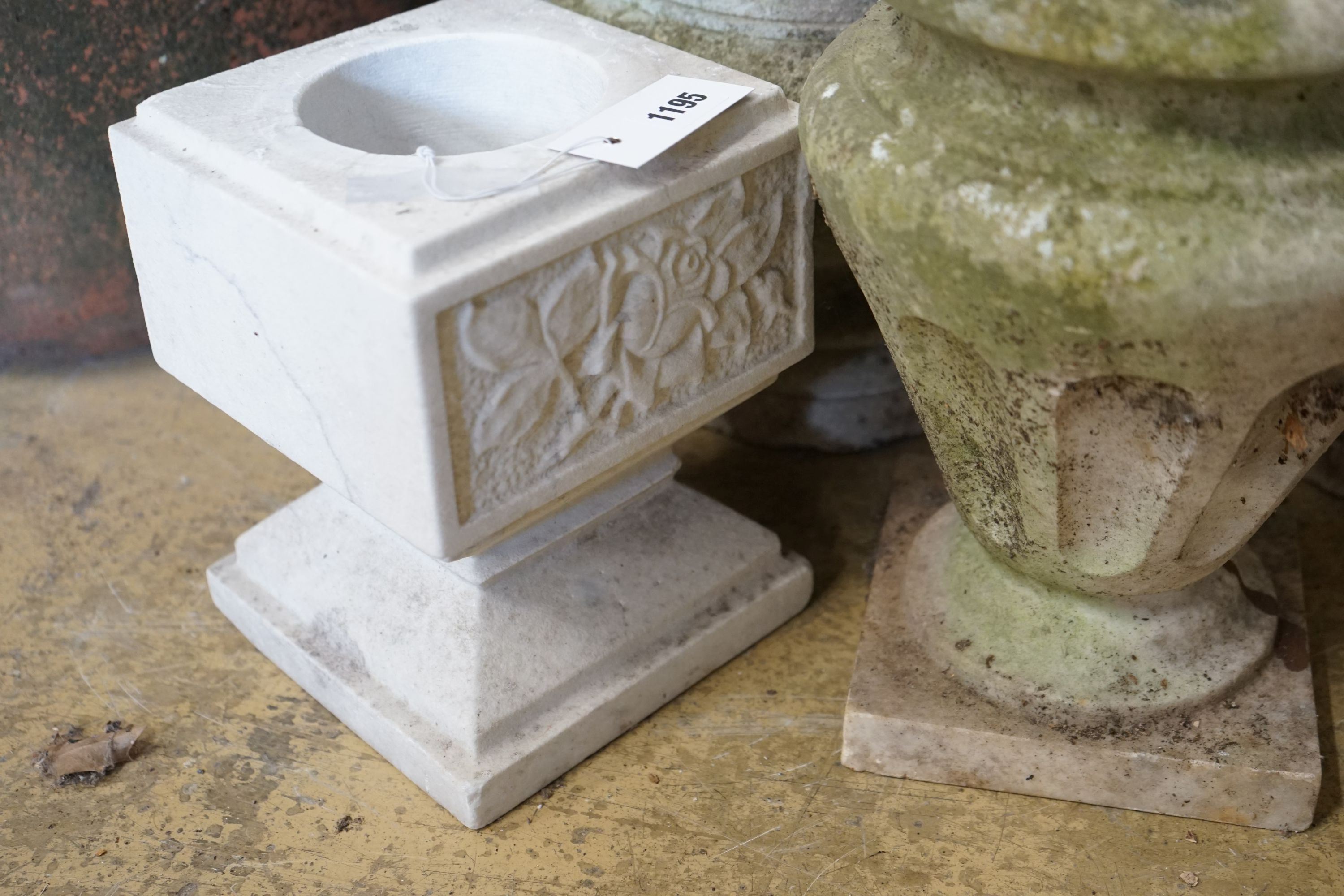 Five marble urns, largest height 31cm